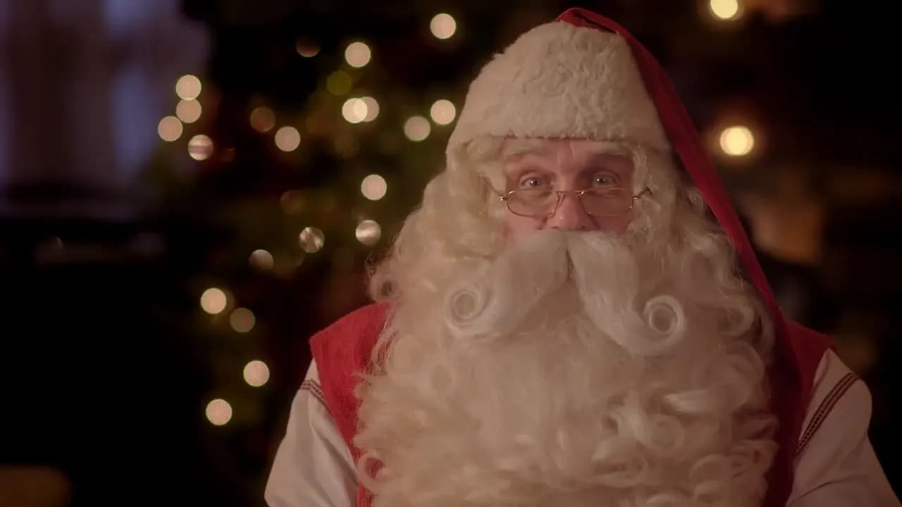 Le Père Noël lit une liste de jouets