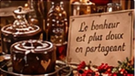 Chocolats et pancarte : Le bonheur est plus doux en partageant